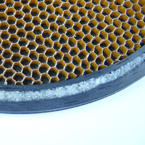 Nomex surrounded by a doubl band of undirectional carbon which with Divinycell foam between the two rings. Makes for an incredibly strong bat.