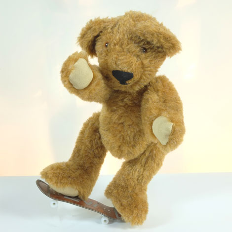 Levi pulling a wheelie on his skateboard