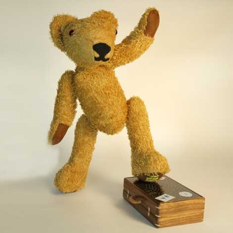 MacEwan one foot on his suitcase waving to his fans