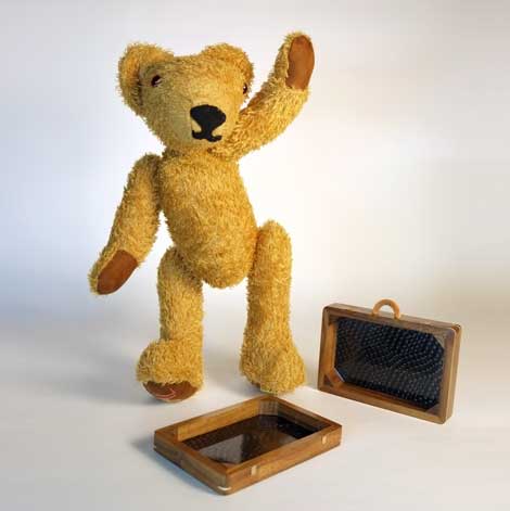 MacEwan one foot on his open suitcase waving to his fans