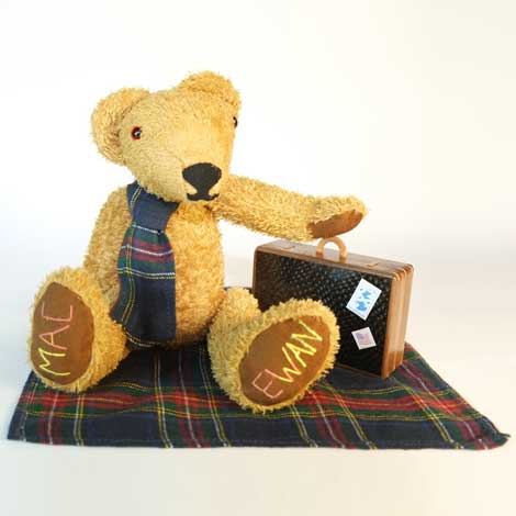 MacEwan with tartan tie on tartan picnic blanket