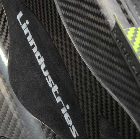 carbon fibre handbag, showing the screen printed Lindustries logo on the Ultrasuede