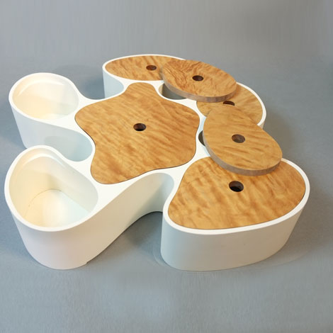 teddy in chair waving