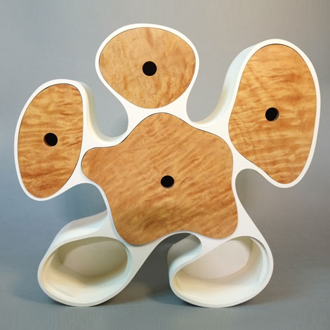 teddy leaning over back of chair